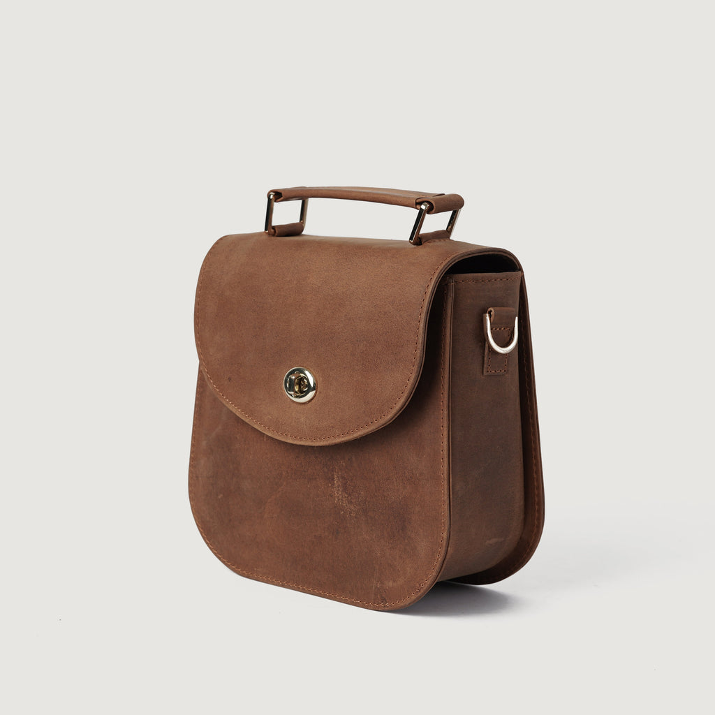 The Sandra Vintage Tan Milled Leather Saddle Bag